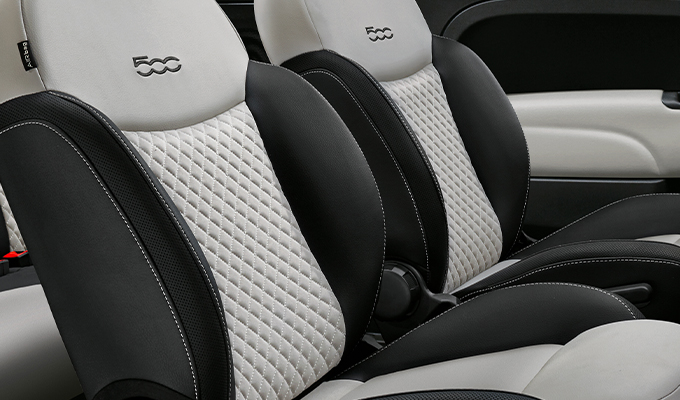 Dedicated black sand Matelassé fabric seats with techno leather details